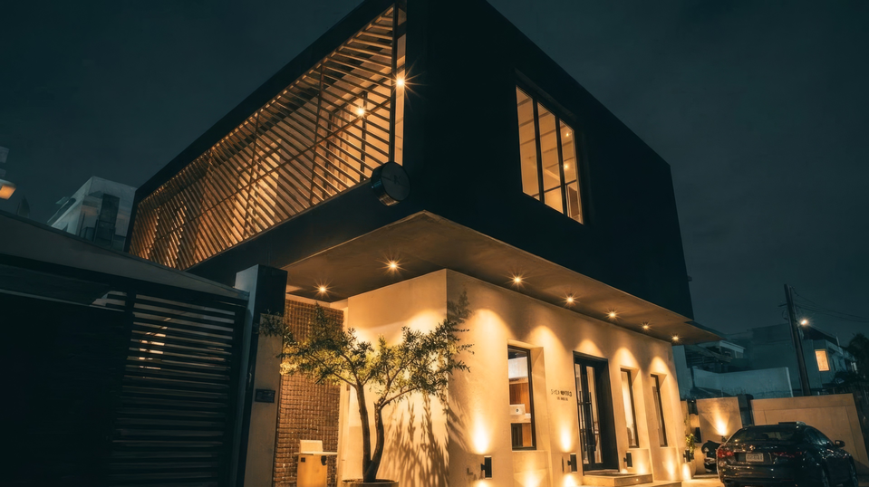 Modern house exterior lit at night